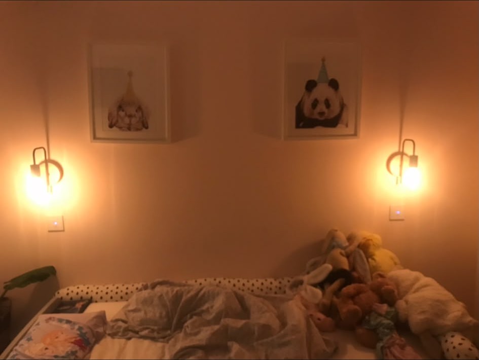 Wall light installation completed and switched in a finished room