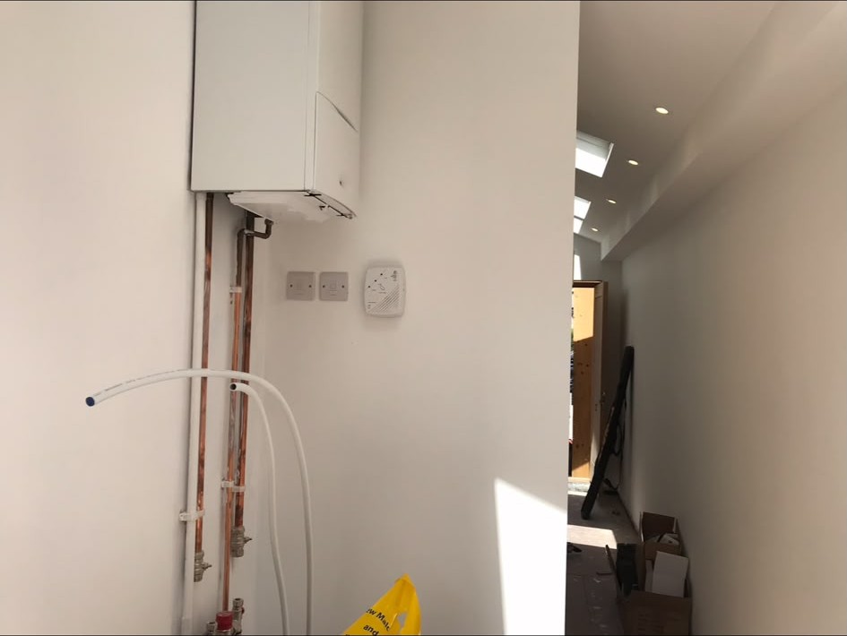 Boiler and hallway lighting installation in progress
