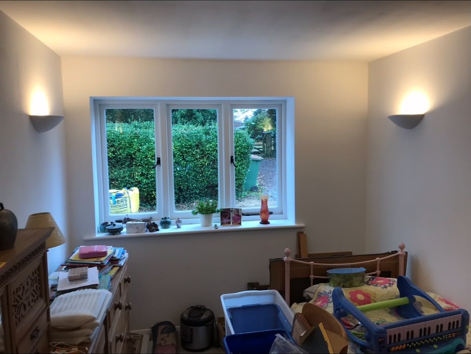 Wall light installation completed and switched in a finished room