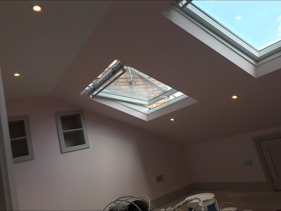 Recessed LED downlights installed and wired into a finished ceiling