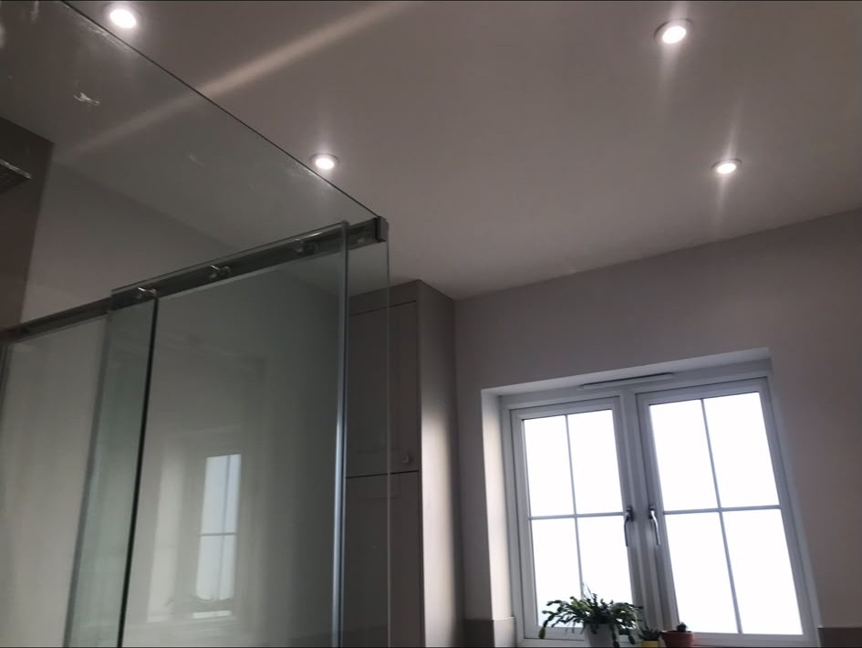 Recessed LED downlights installed and wired into a finished ceiling