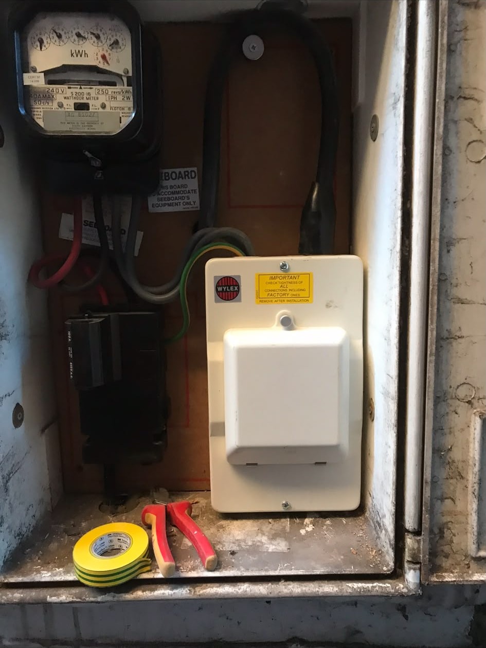 New consumer unit fitted beside the meter during a fuse box upgrade