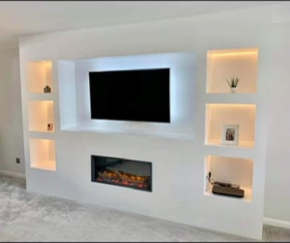Media wall with backlit television and illuminated display niches