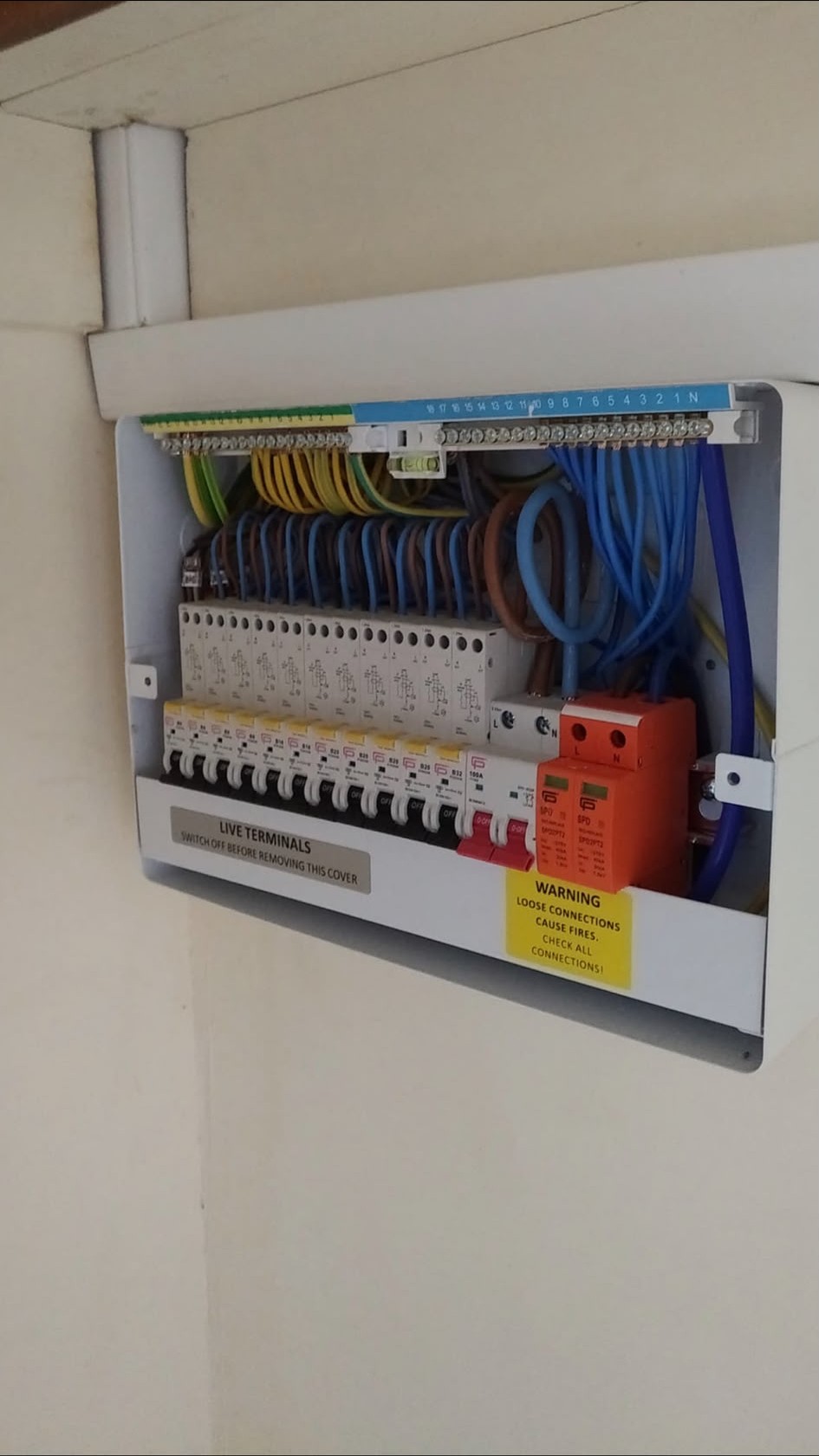 Open consumer unit showing new RCBO protection and neatly terminated circuits