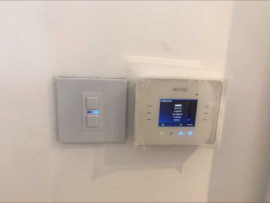 Heating control and switch wired beside a boiler