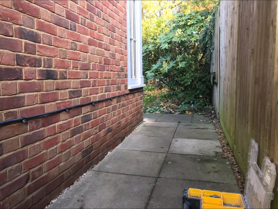 External cabling run neatly along brickwork
