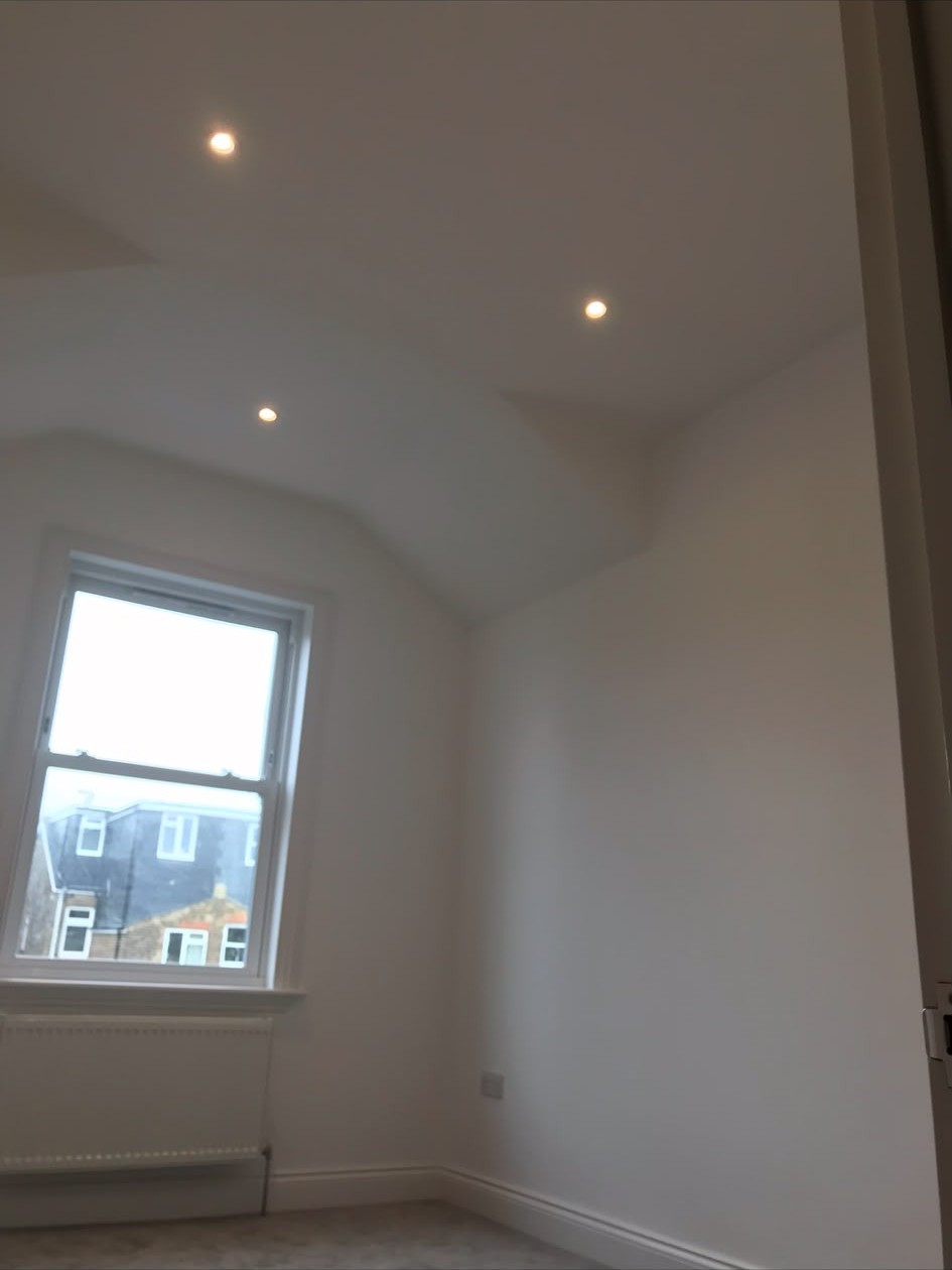 Recessed LED downlights installed and wired into a finished ceiling