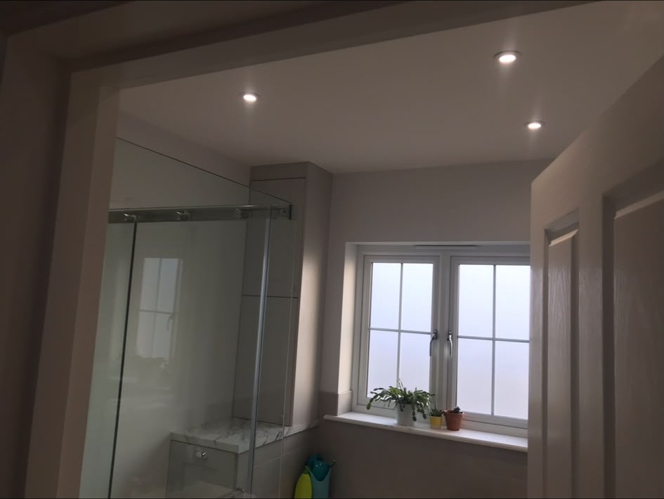 Recessed LED downlights installed and wired into a finished ceiling